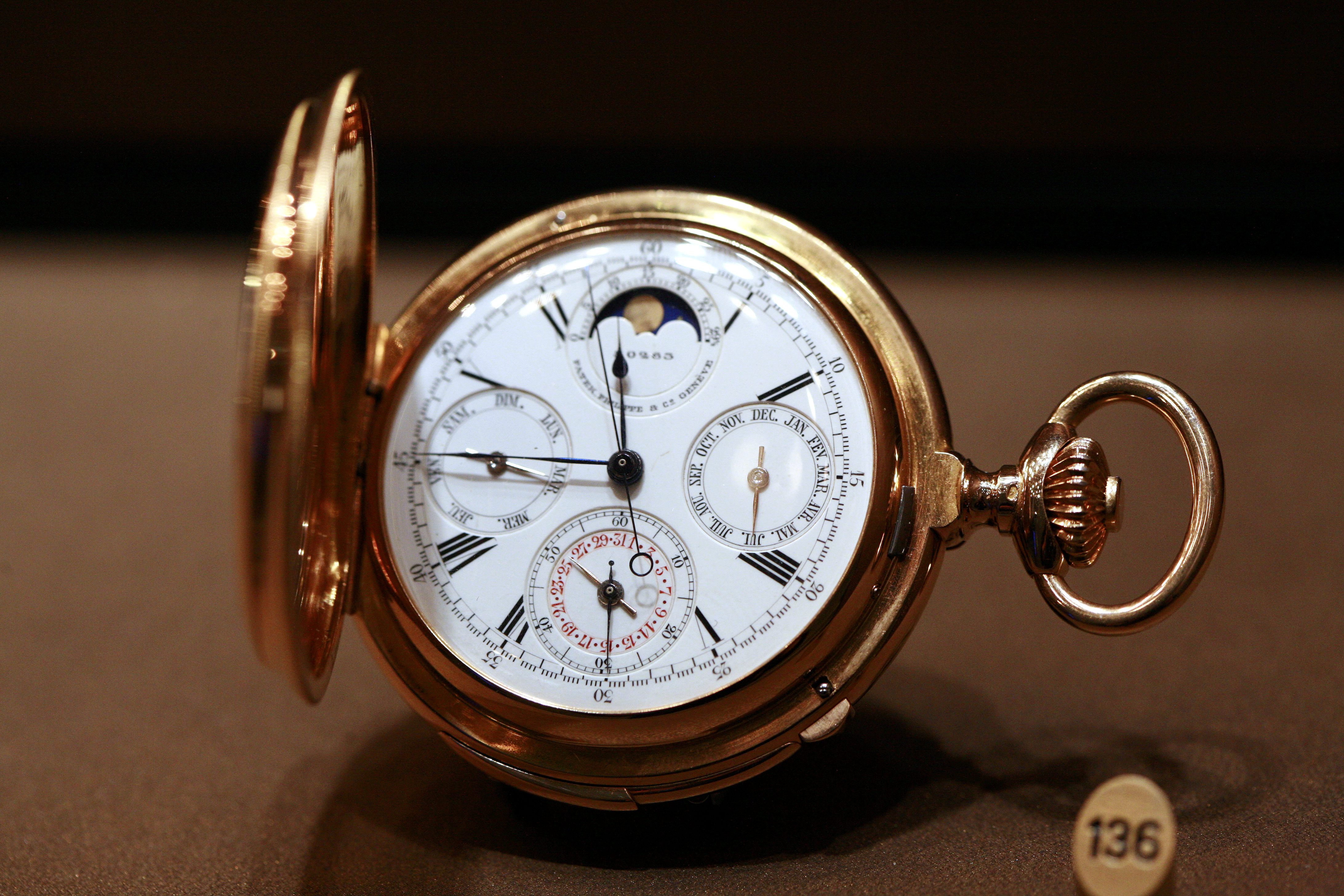 Odprt mehanizem zgodovinske žepne ure Patek Philippe; ilustracija visoke urarske obrti